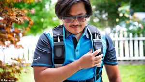 The glasses sync up with a small controller worn on the driver's vest, which contains controls, a swappable battery, and an emergency button