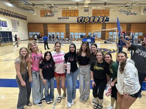 Two former Jurupa Valley players, Hadeel Hazameh and Alyssa McPherson, were among those holding signs and wearing shirts after stepping away from the team in September