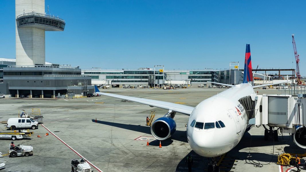 JFK Airport (Pictured) has issued a ground stop due to an emergency on board an imcoming aircraft