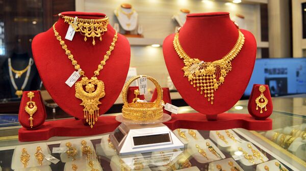 Gold necklaces displayed at a jewellery shop ahead of Dhanteras at Karimpur, in Nadia on Friday.