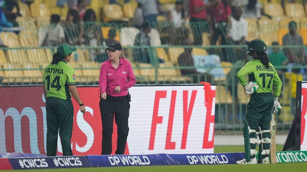 Pakistan's captain Fatima Sana, left, speaks to umpire about the dismissal of Muneeba Ali, right, during the ICC Women's Cricket World Cup match between India and Pakistan at Premadasa Stadium in Colombo, Sri Lanka, Sunday, Oct, 5, 2025.