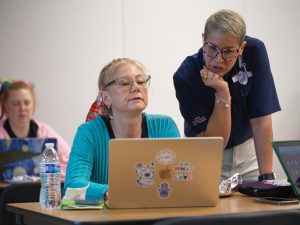Middle school teachers confer during a Microsoft AI skills workshop in San Antonio Texas, this year
