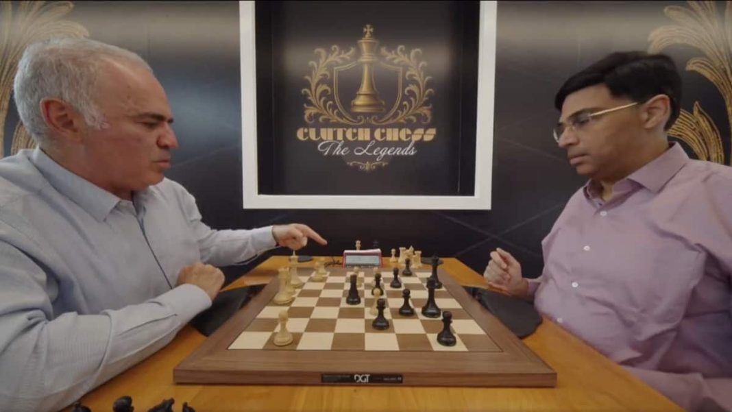 Garry Kasparov points towards the clock during Game 5 against Viswanathan Anand in Clutch Chess: The Legends. Image credit: Screengrab/chess24