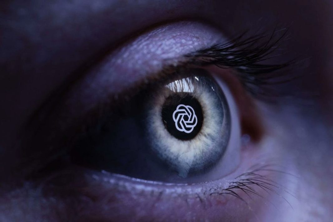 The OpenAI company logo reflected in a human eye at a studio in Paris on 6 June, 2023 (AFP/Getty)