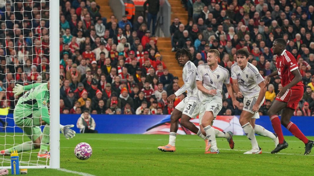 Manchester United's Harry Maguire, second right, scores his side's second goal during the English Premier League soccer match between Liverpool and Manchester United in Liverpool, England, Sunday, Oct. 19, 2025. (AP Photo/Ian Hodgson)