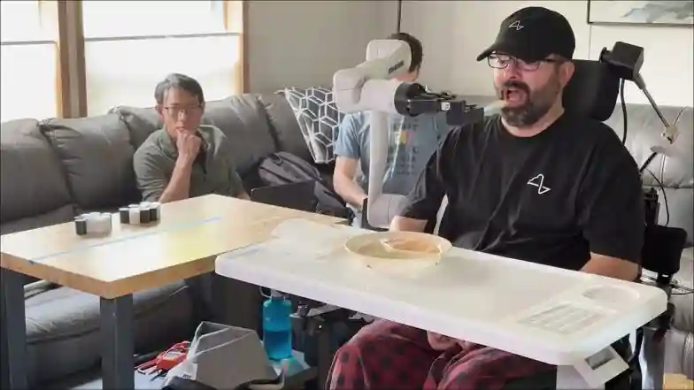 Neuralink Patient Nick Wray Eating With Robotic Arm (Photo Credits: X/@Neuralink)
