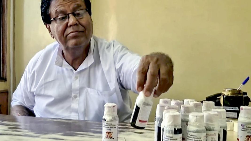 An official looks at bottles of the ‘Coldrif’ cough syrup after a raid by the Drug and Pharmaceuticals Department officials at Kataria Pharmaceuticals, after the deaths of 11 children, nine in Madhya Pradesh and two in Rajasthan, allegedly linked to contaminated cough syrup, in Jabalpur, Madhya Pradesh, on October 4, 2025. | Photo Credit: PTI