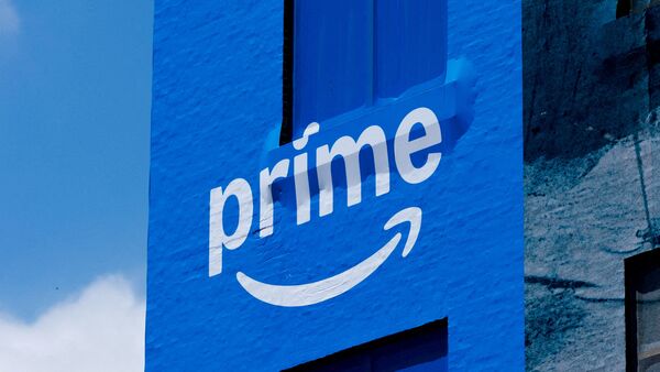 A building in San Diego, California, wrapped in Amazon Prime advertising. Here's how customers can claim $51 settlement payout from the company.