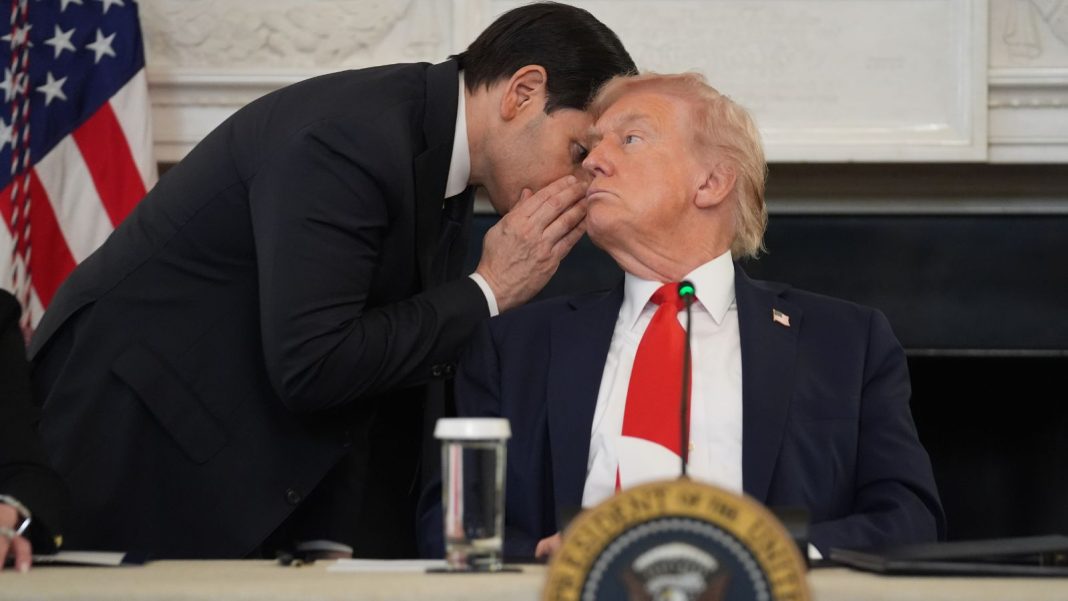 Rubio whispers to Trump, who holds the note, during the White House antifa roundtable, Washington. (AP Photo)