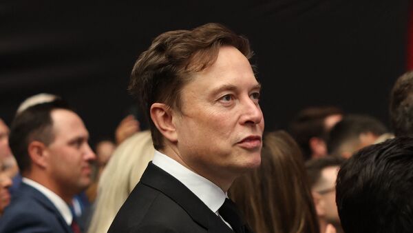 File photo of Tesla CEO Elon Musk at the public memorial service for right-wing activist Charlie Kirk in September. Tesla proxy adviser ISS has advised shareholders to oppose the EV maker's proposed $1 trillion pay package for the billionaire.