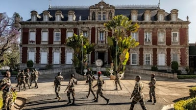 Members of the CAPSAT military unit walked towards the presidential palace after seizing power in Madagascar. (AFP)