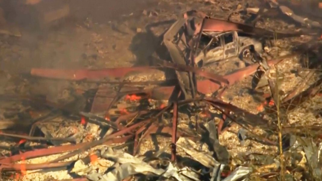 Debris covers the ground and vehicles after a powerful blast ripped through a military explosives manufacturing plant in Hickman County. (Photo: AP)
