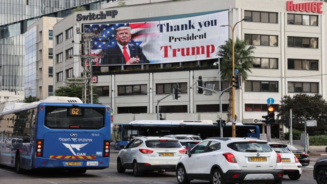 A billboard displays an image of US President Donald Trump with a message thanking him for reaching a ceasefire deal in Gaza, on the side of a building in Tel Aviv's Hostage Square. AFP