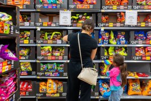 A family shops for Halloween candy at a Walmart Supercenter on October 16, 2024 in Austin, Texas.