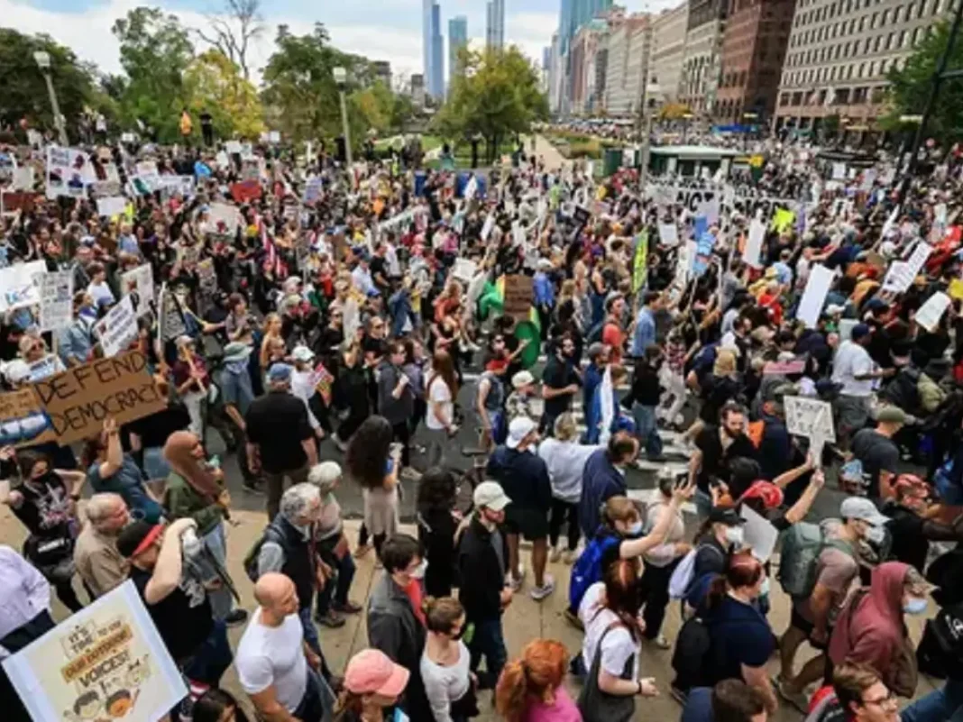 Protesters march in the No Kings protest on Saturday in Chicago, Illinois.