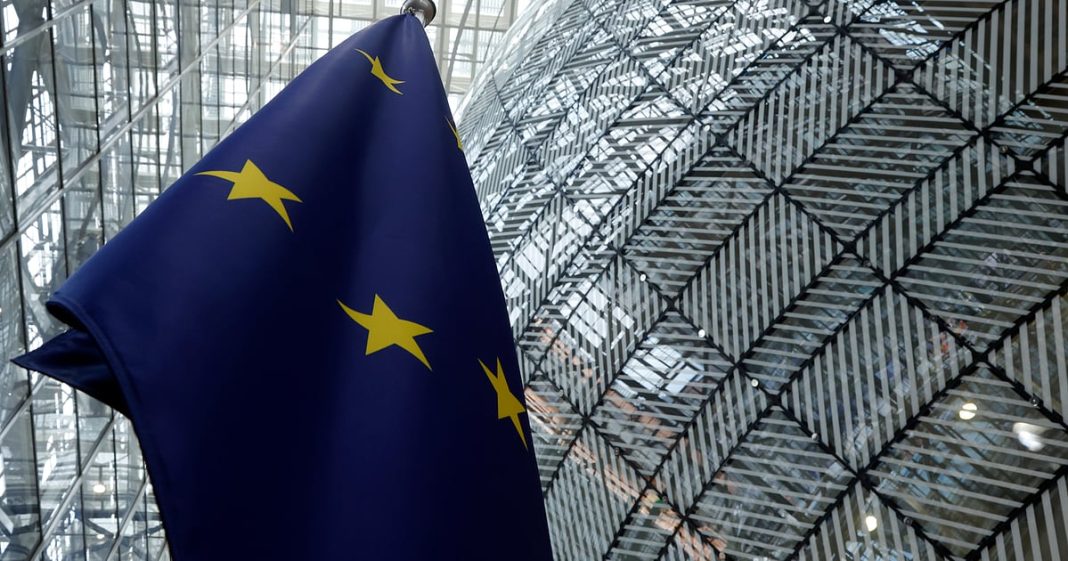 The European Union flag stands inside the atrium at the European Council building in Brussels, June 17, 2024.
