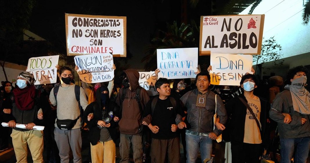 Opponents of Peruvian President Dina Boluarte protest outside of the Ecuadorian Embassy in Lima, Peru, Thursday, Oct. 9, 2025.