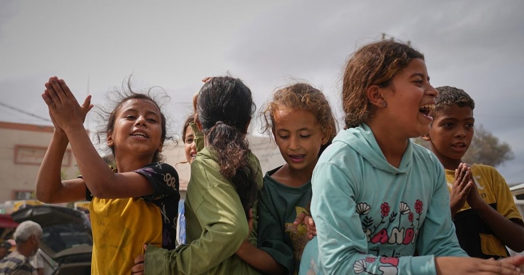 Palestinians celebrate following the announcement that Israel and Hamas have agreed to the first phase of a peace plan to pause the fighting, in Khan Younis, southern Gaza Strip, Thursday, Oct. 9, 2025. Celebrations remain limited, as relief is mixed with mourning and concern for what comes next.