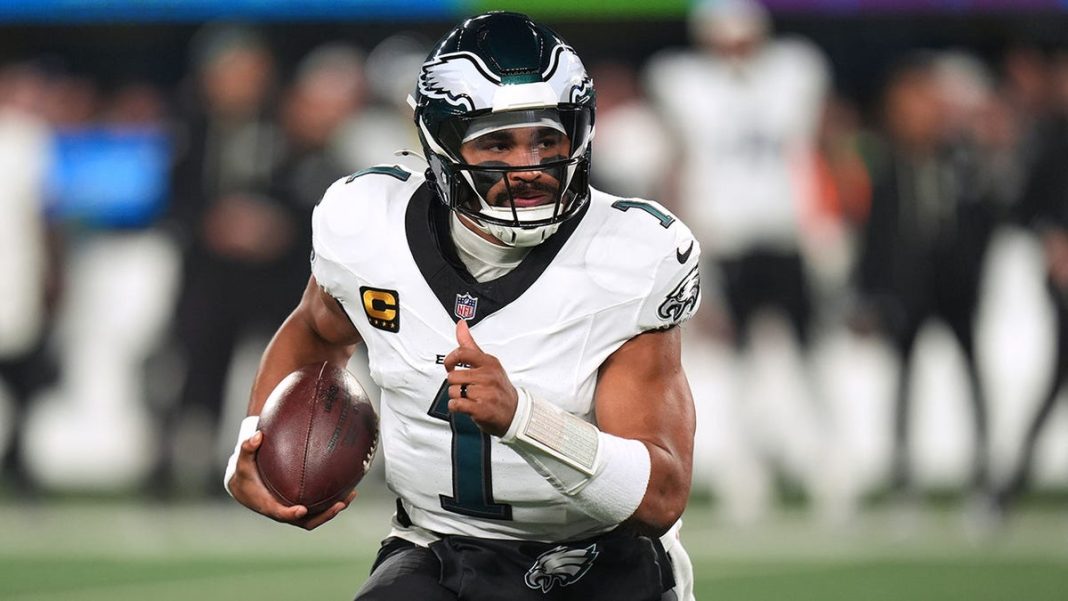 Philadelphia Eagles' Jalen Hurts runs during the first half of an NFL football game against the New York Giants Thursday, Oct. 9, 2025, in East Rutherford, New Jersey.
