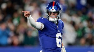 New York Giants' Jaxson Dart reacts after a touchdown during the first half of an NFL football game against the Philadelphia Eagles Thursday, Oct. 9, 2025, in East Rutherford, New Jersey. (AP Photo/Adam Hunger)