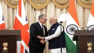 Britain’s Prime Minister Keir Starmer shakes hands with his Indian counterpart Narendra Modi during a joint press conference after their bilateral meeting in Mumbai. AFP