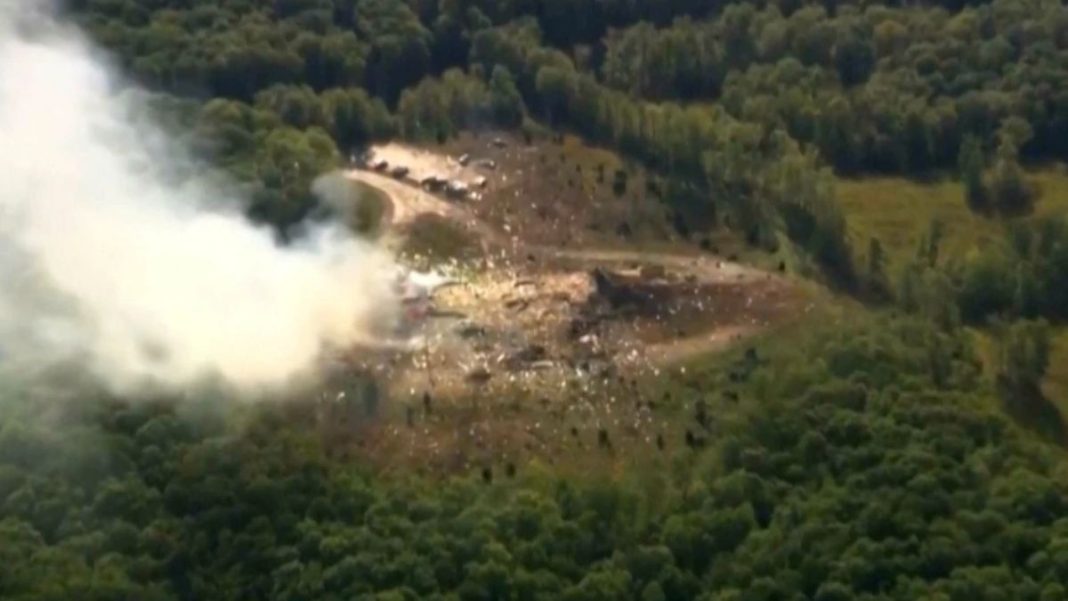 Smoke fills the air as debris covers the ground and vehicles after a powerful blast ripped through a military explosives manufacturing plant in Hickman County. (AP Photo)