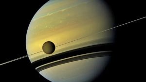Titan is seen next to Saturn. (Photo: Nasa)