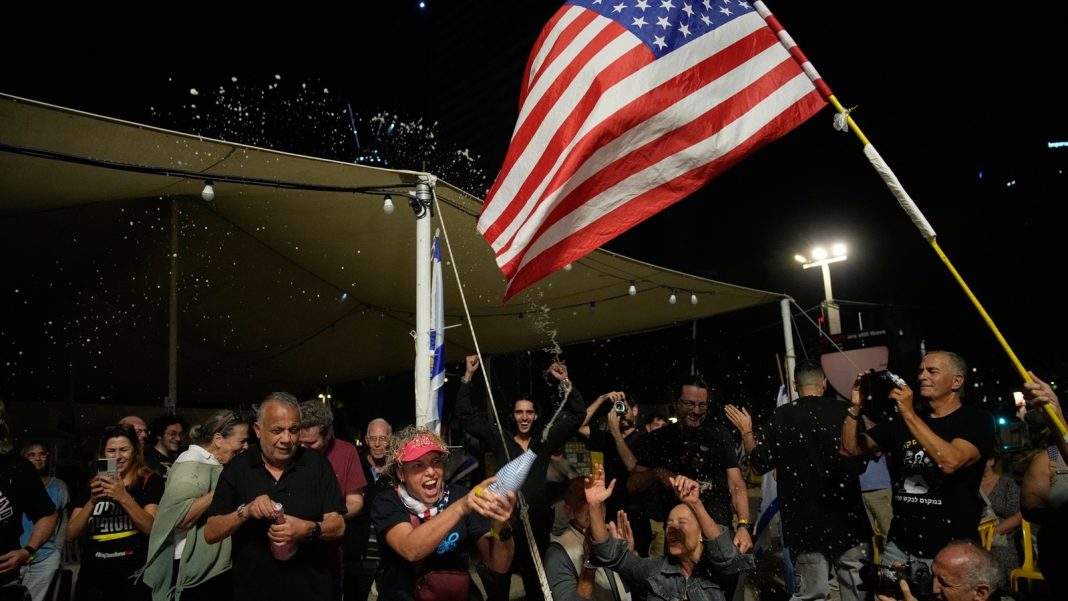 Israel Hamas ceasefire: Relatives and supporters of Israeli hostages held by Hamas in the Gaza Strip celebrate after the announcement that Israel and Hamas have agreed to the first phase of a peace plan, as they gather at a plaza known as the hostages square in Tel Aviv, Israel. (AP Photo)