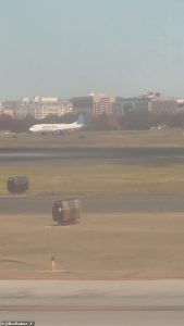 Travelers stranded on the runway said there was a bomb threat on a United flight that landed from Houston, which was quickly surrounded by emergency vehicles