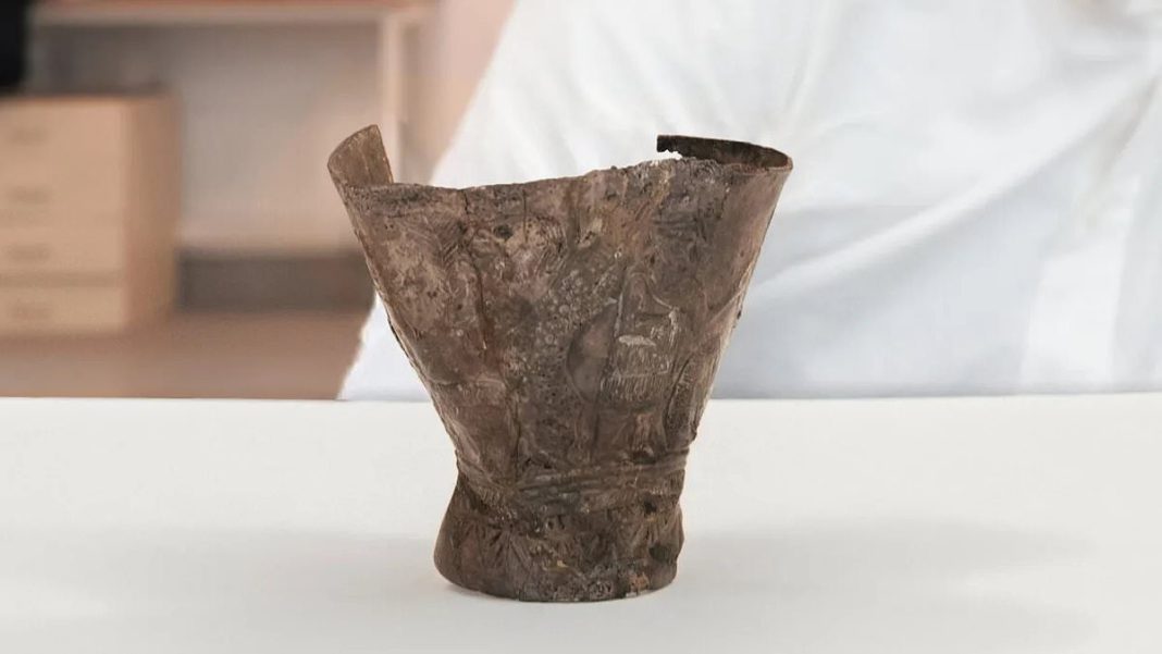 The artifact, known as the Ain Samiya goblet, stands just three inches tall and is decorated with intricate images of snakes, chimeras, gods, celestial bodies and a mysterious 'boat' of light