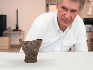 The artifact, known as the Ain Samiya goblet, stands just three inches tall and is decorated with intricate images of snakes, chimeras, gods, celestial bodies and a mysterious 'boat' of light