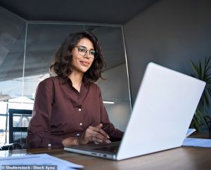 An experiment which has been rerun has found the female applicant was ranked as marginally more capable and appealing to work with (stock image of a woman in front of a computer)