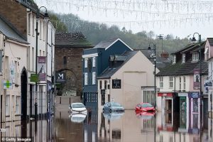 Researchers say that the unexpectedly rapid change means the UK may not be prepared to face the worst effects of climate change. Pictured: Flooding in Monmouth