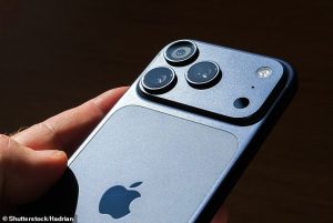 Apple will ship around 243 million phones this year compared with 235 million for Samsung, according to Counterpoint Research. Pictured, iPhone 17 Pro Max