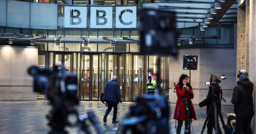 Members of the media wait outside the entrance to the BBC in London on Nov. 10, 2025.