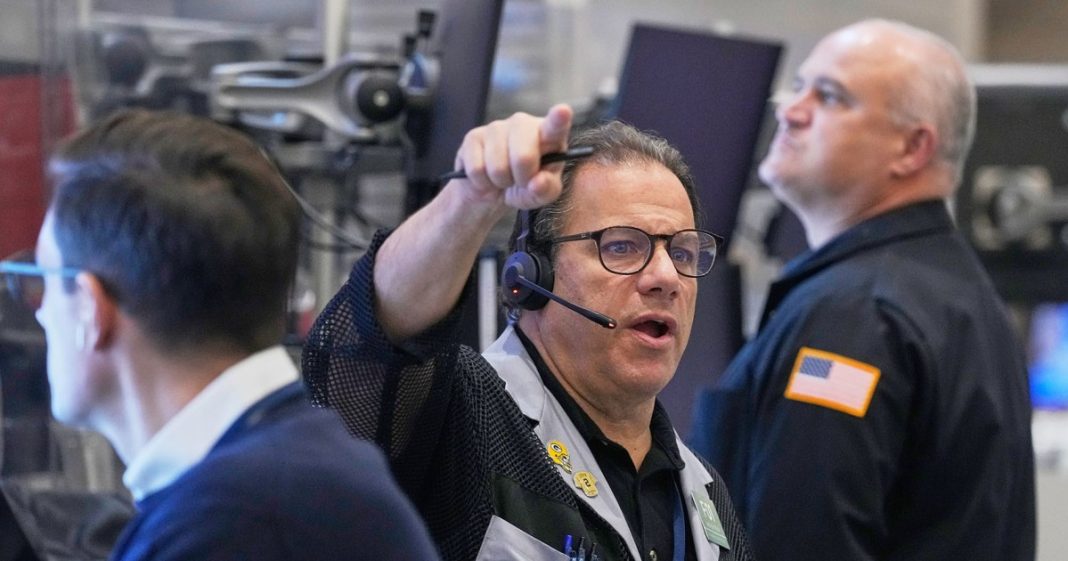 An options trader works Thursday on the floor of the New York Stock Exchange.