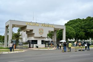 Journalists stand outside the Brazilian Federal Police Headquarters in Brasilia on Nov. 22 Evaristo Sa / AFP - Getty Images