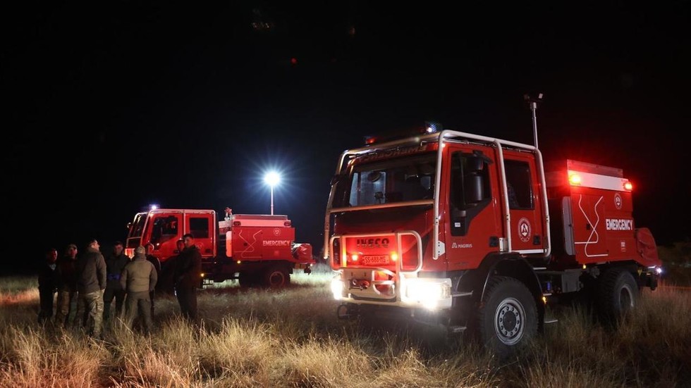 Georgian officials at the crash site of a Turkish Air Force C-130 transport plane near the Georgian-Azerbaijani border on November 11, 2025. ©  Georgian Ministry of Interior / Anadolu / Getty Images