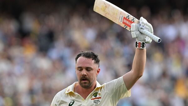 Australia's Travis Head acknowledges the applause from spectators as he walks back after his dismissal on the day 2 of the first Ashes cricket Test match between Australia and England at Perth Stadium in Perth on November 22, 2025.
