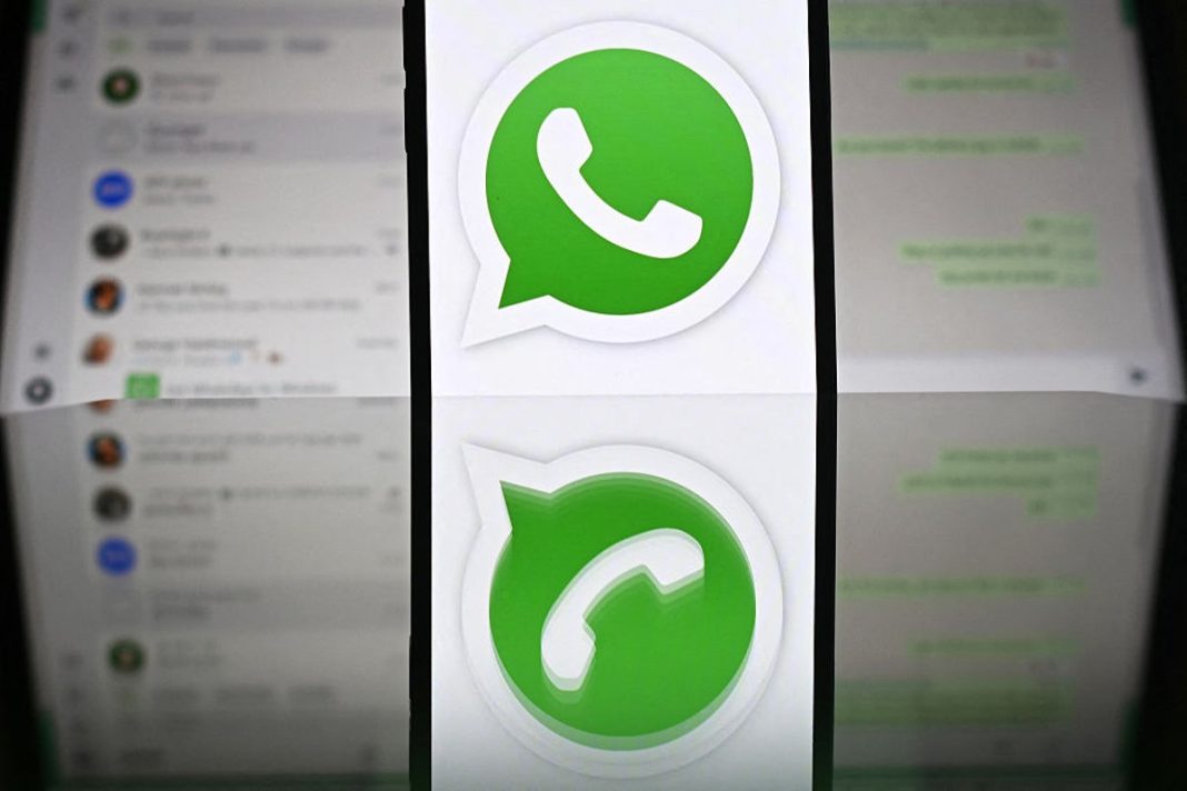 The WhatsApp logo pictured in front of a laptop screen in Guildford, UK, on 17 April, 2025 (AFP via Getty Images)