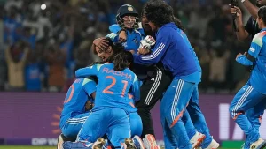 India's players celebrate after winning the ICC Women's Cricket World Cup semi-final against Australia in Navi Mumbai. - AP