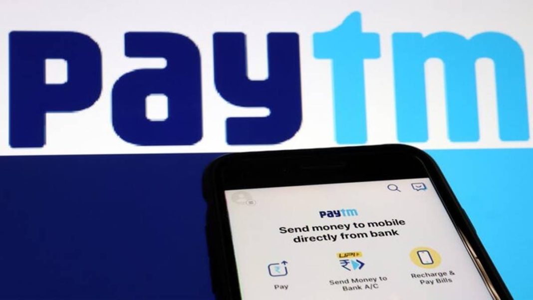 The interface of Indian payments app Paytm is seen in front of its logo displayed in this illustration. (Photo source: Reuters)