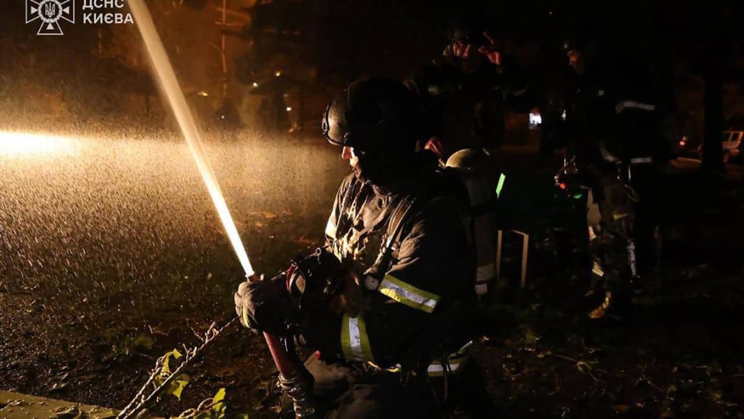 Ukrainian rescuers work to extinguish a fire at the site of an airstrike in Kyiv. (File photo/AP)