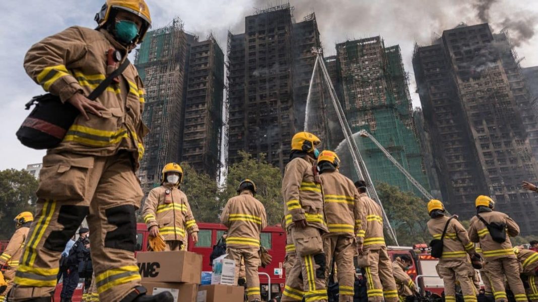 Firemen get ready after a major fire swept through several apartment blocks at the Wang Fuk Court residential estate in Hong Kong's Tai Po district on November 27, 2025. Image- AFP