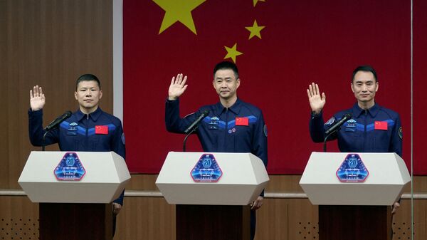 FILE PHOTO: Astronauts Chen Dong, Chen Zhongrui and Wang Jie