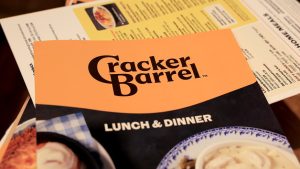 The new Cracker Barrel logo is seen on a menu inside the restaurant on Aug. 21, 2025 in Pembroke Pines, Fla. The restaurant unveiled a new logo earlier this week as part of a larger brand refresh. (Joe Raedle/Getty Images / Getty Images)