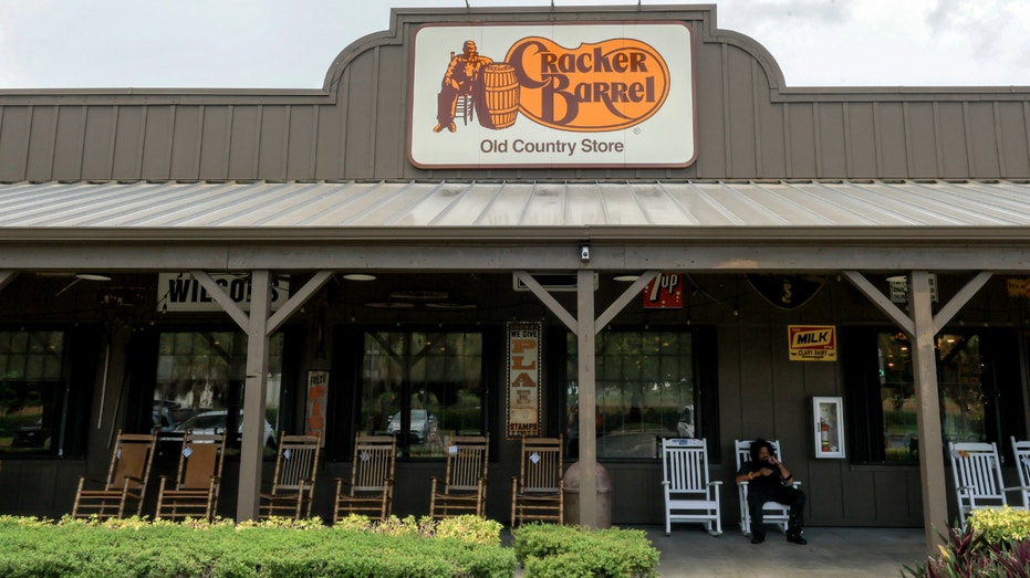 A Cracker Barrel sign featuring the old logo hangs on the outside of a restaurant on Aug. 21, 2025, in Homestead, Fla.