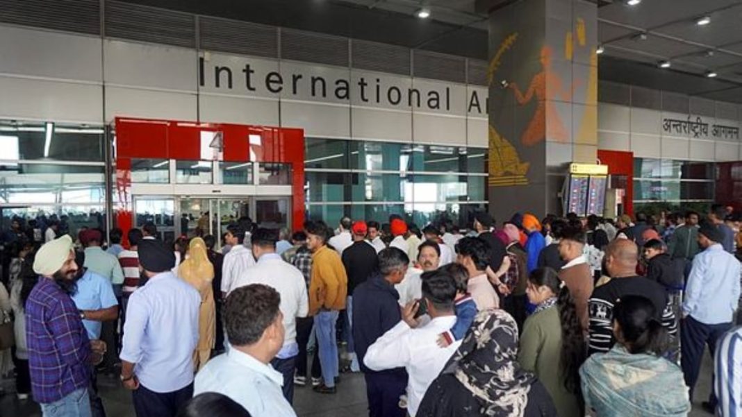 People wait outside the arrivals’ exit at the Indira Gandhi International (IGI) Airport, in New Delhi. (Image: PTI)
