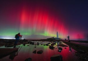 The aurora borealis danced in the skies over St. Mary's Lighthouse in Whitley Bay on the northeast coast of England on Wednesday.