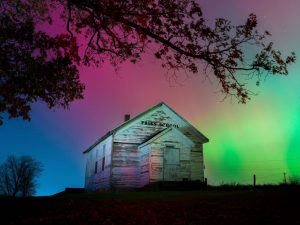 A rainbow of colors triggered by severe solar storm activity can be seen in the night sky over Monroe, Wisconsin, on Tuesday, November 11.